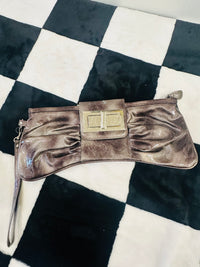 Acid wash bow clutch bag