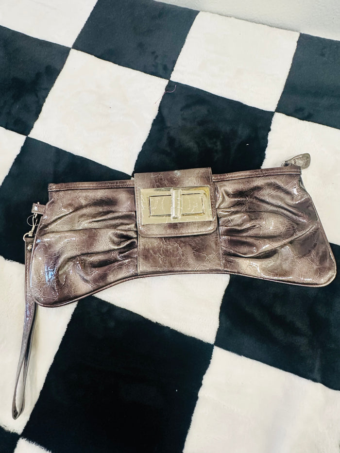 Acid wash bow clutch bag