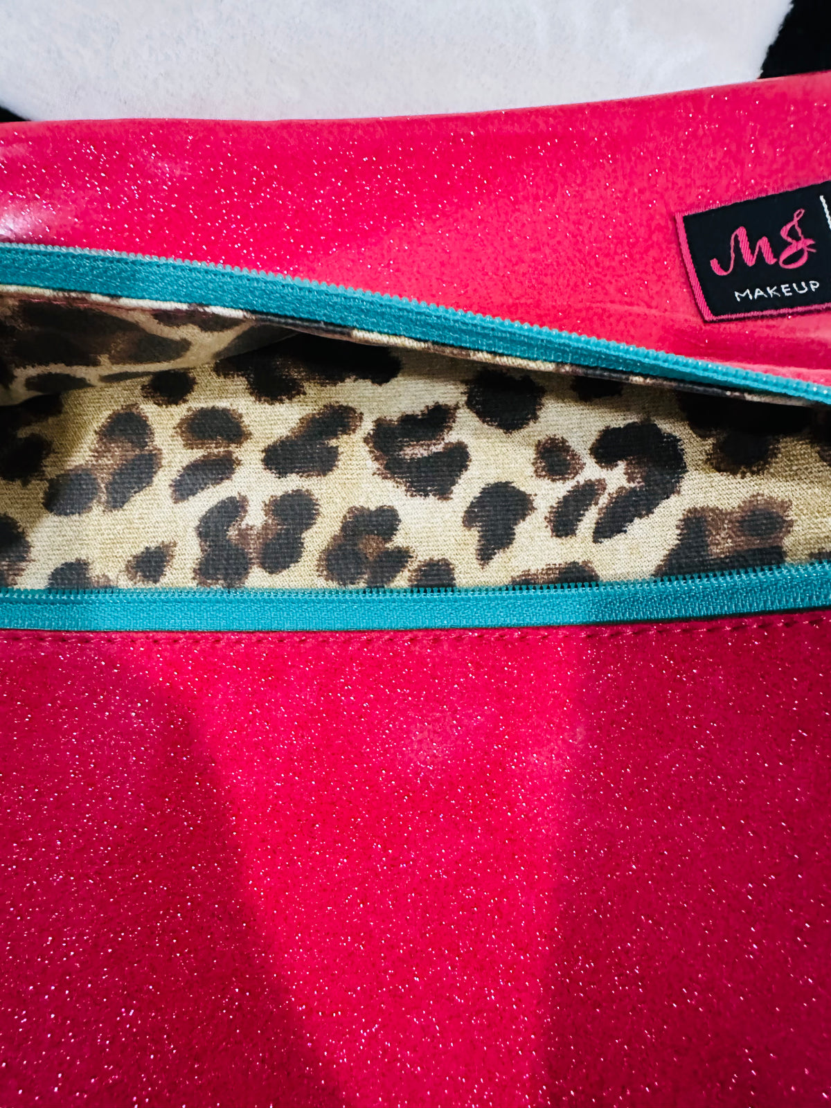 Hot pink glitter med. MJ BAG  with teal zipper and leopard inside.