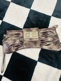 Acid wash bow clutch bag