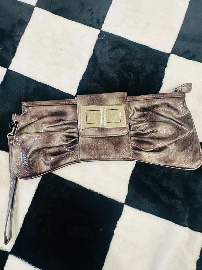 Acid wash bow clutch bag