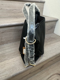 Black asymmetrical coverable handbag to backpack