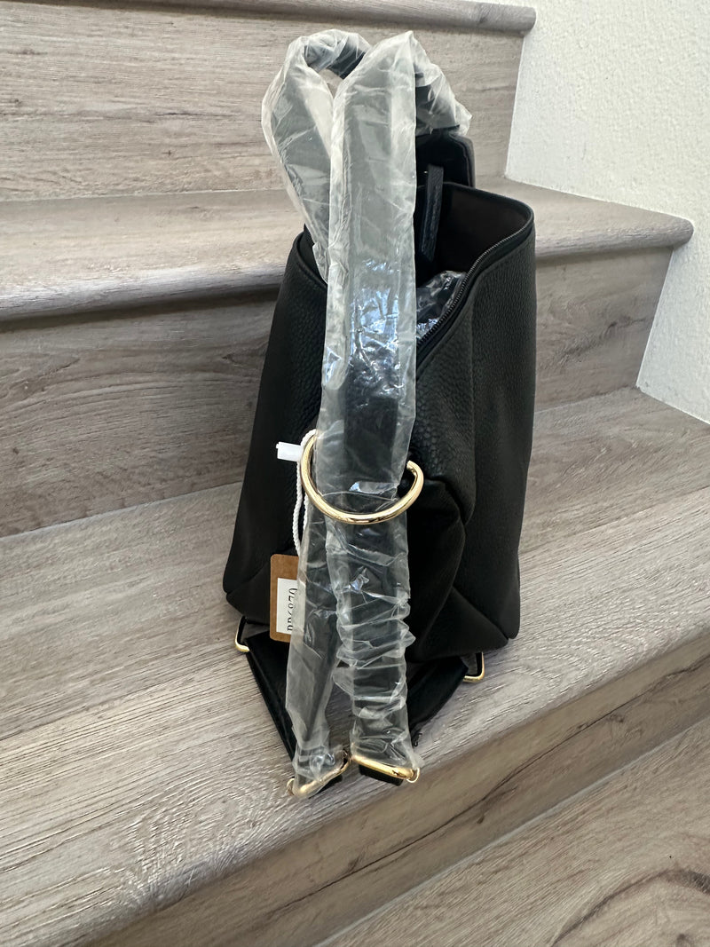 Black asymmetrical coverable handbag to backpack