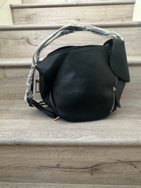 Black asymmetrical coverable handbag to backpack